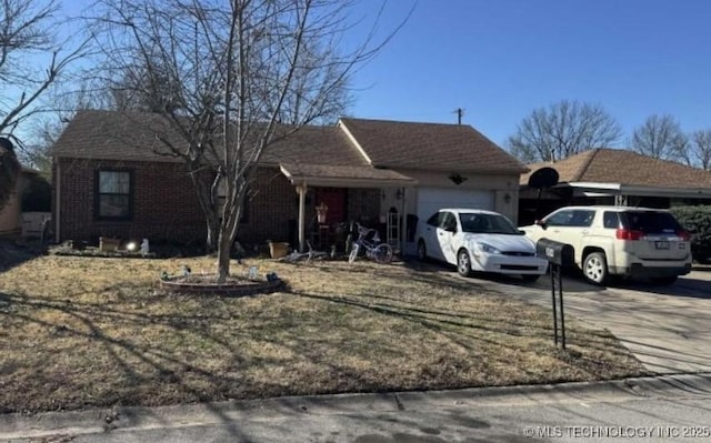 ranch-style home with brick siding, driveway, and a garage