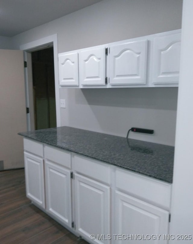 kitchen with white cabinets and dark wood-style floors