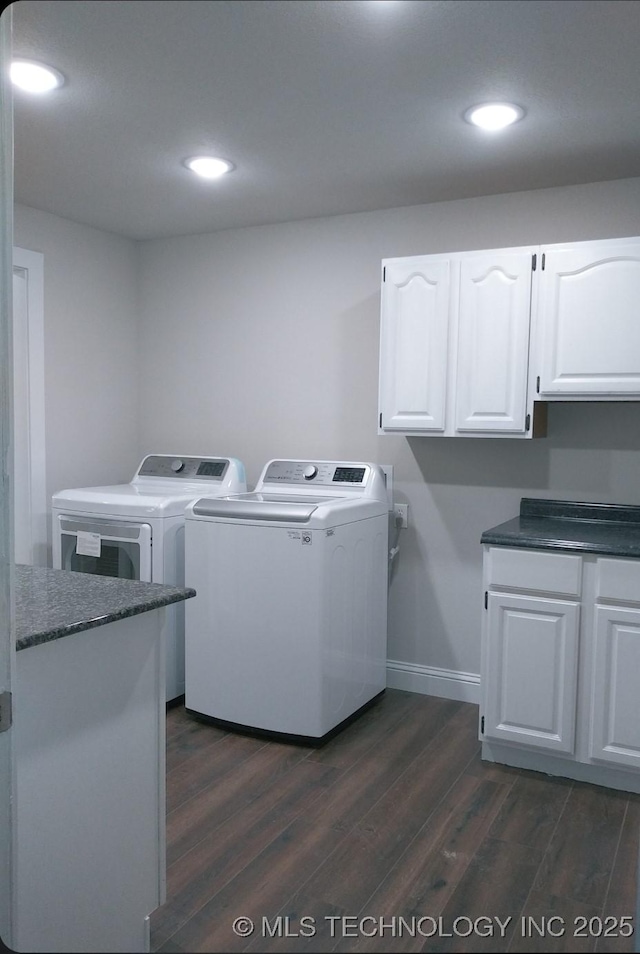 laundry room with recessed lighting, cabinet space, dark wood-style flooring, and washing machine and clothes dryer