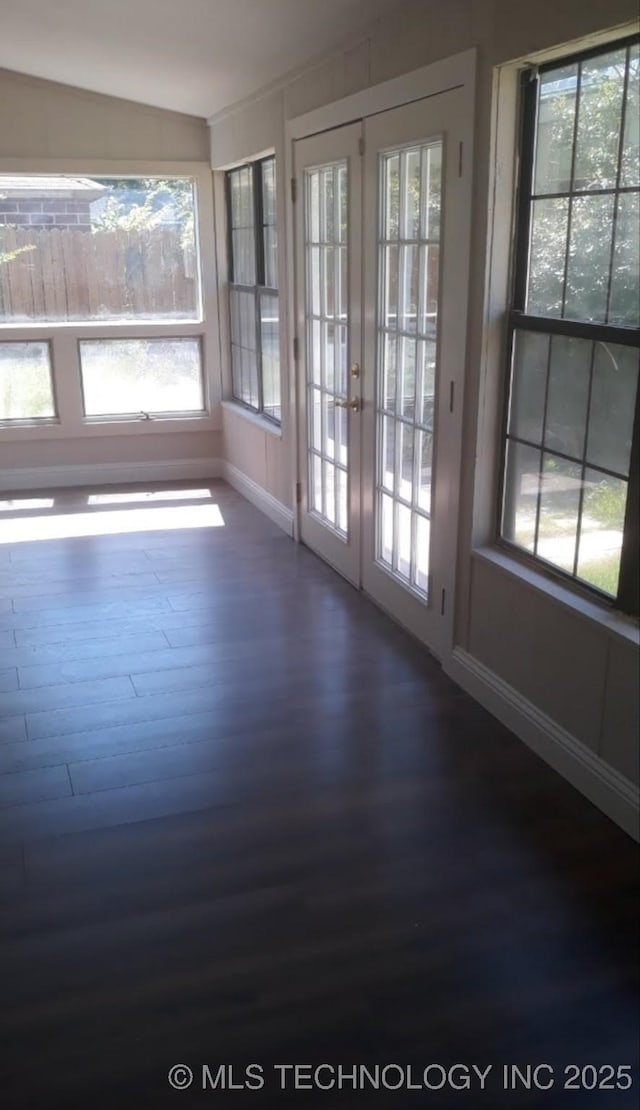 unfurnished sunroom with french doors