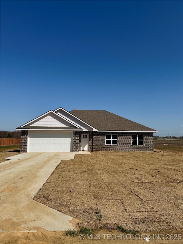 ranch-style house featuring brick siding, concrete driveway, and an attached garage