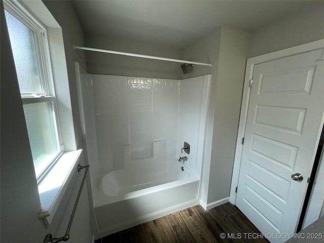 full bath with wood finished floors and shower / bathtub combination