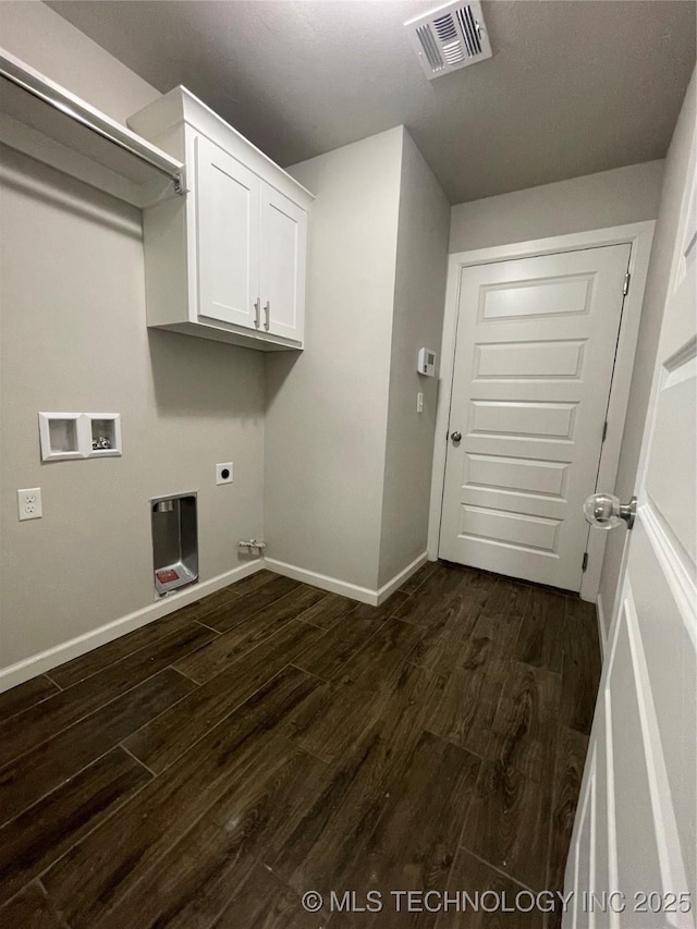 washroom with visible vents, dark wood-type flooring, baseboards, hookup for a washing machine, and hookup for an electric dryer