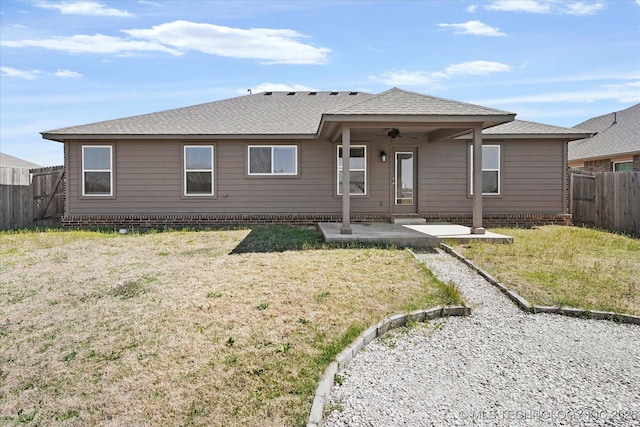 408 S 48th Ct S, Broken Arrow, OK 74014 - back of house with a fenced backyard, a lawn, roof with shingles, and a patio