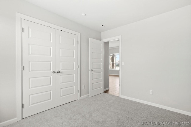 408 S 48th Ct S, Broken Arrow, OK 74014 - unfurnished bedroom with baseboards, a closet, and carpet flooring