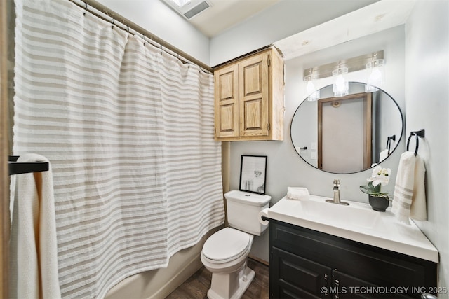 bathroom featuring visible vents, toilet, wood finished floors, vanity, and shower / bathtub combination with curtain