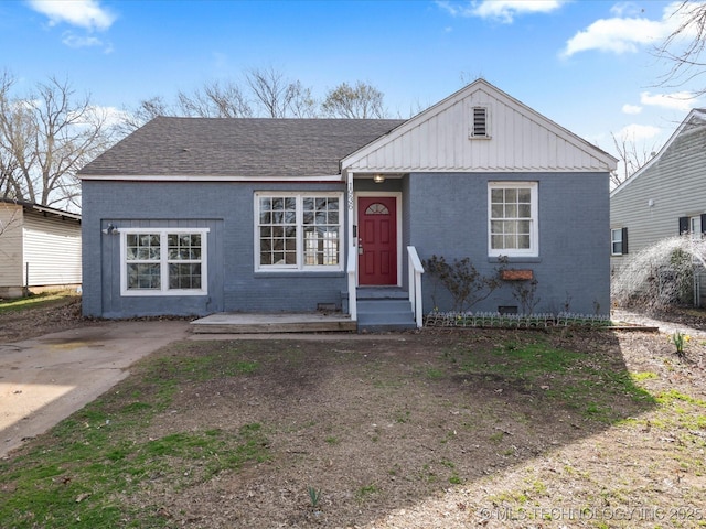 view of front of house featuring brick siding