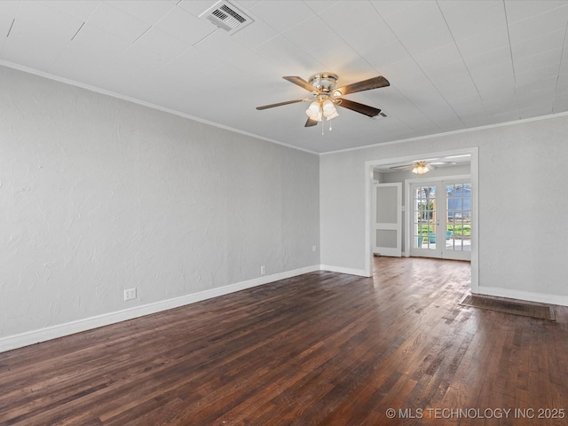 unfurnished room featuring dark wood-style floors, visible vents, ceiling fan, and ornamental molding