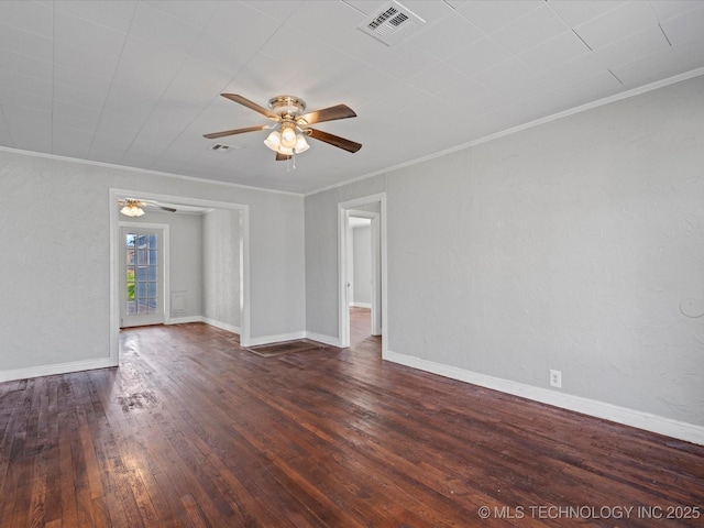 empty room featuring visible vents, crown molding, baseboards, ceiling fan, and hardwood / wood-style floors