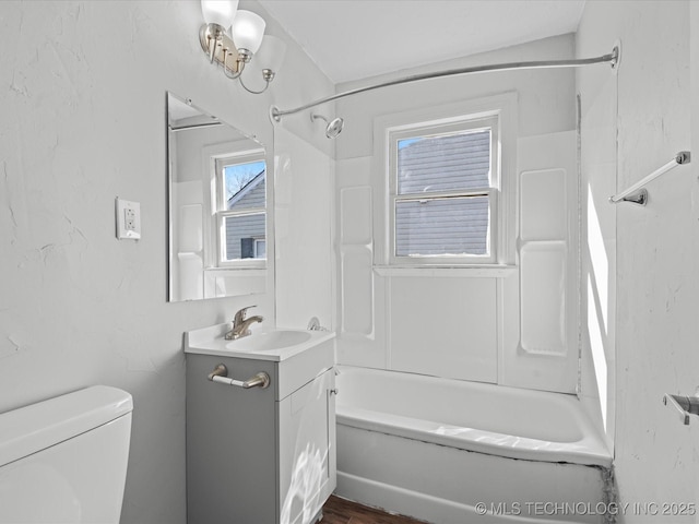 full bathroom featuring tub / shower combination, toilet, and vanity