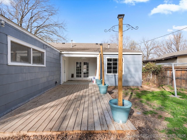 deck with french doors and fence