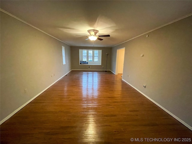 empty room with dark wood finished floors, a ceiling fan, baseboards, and ornamental molding