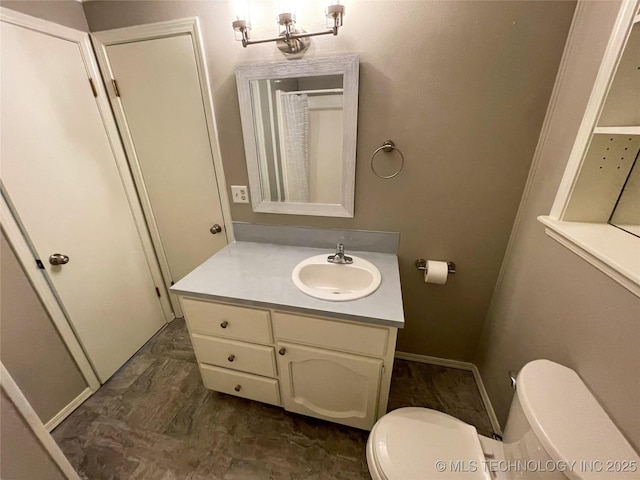 full bathroom featuring vanity and toilet