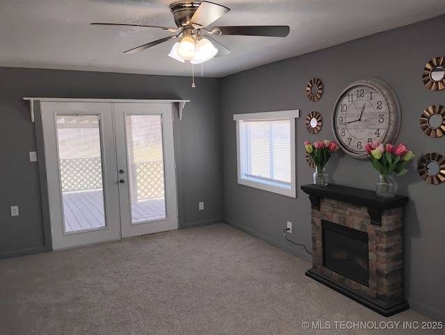 unfurnished living room featuring french doors, carpet floors, and ceiling fan