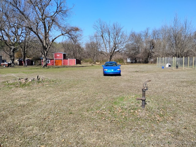 view of yard featuring a barn and an outdoor structure