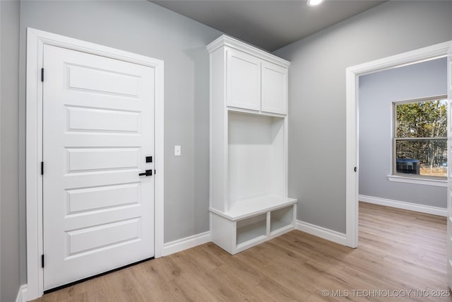 mudroom with recessed lighting, baseboards, and light wood finished floors