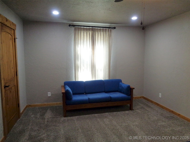 living area with carpet flooring, recessed lighting, and baseboards