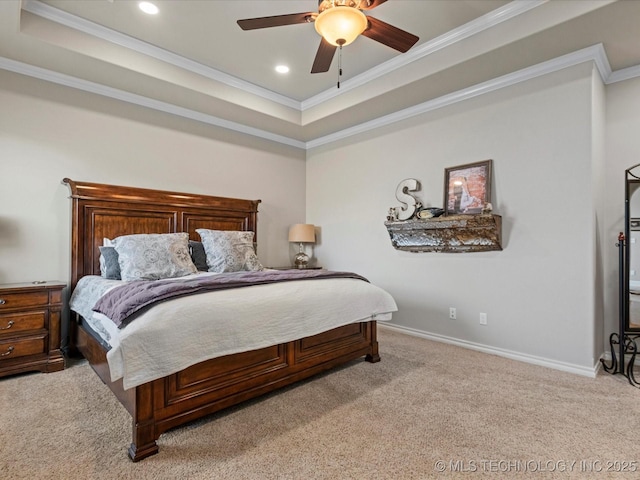 bedroom with carpet, a raised ceiling, crown molding, and baseboards