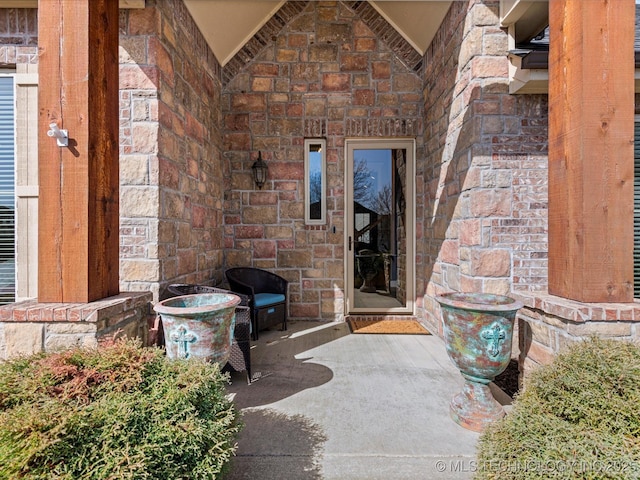 view of exterior entry with stone siding