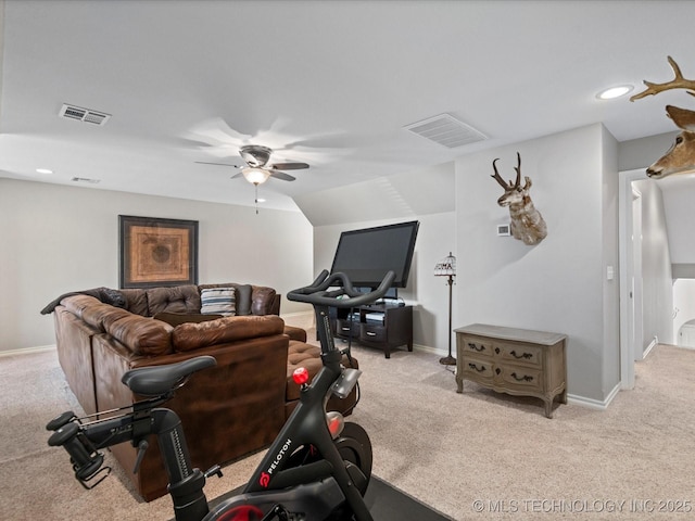 workout area with visible vents, carpet, and a ceiling fan