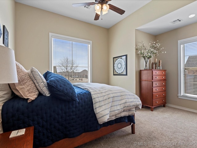 bedroom with visible vents, baseboards, carpet, and a ceiling fan