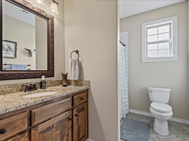 bathroom with tile patterned flooring, visible vents, baseboards, toilet, and vanity