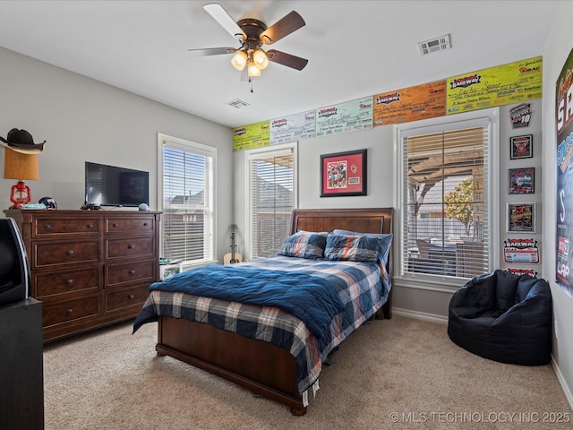 bedroom with ceiling fan, light colored carpet, visible vents, and baseboards