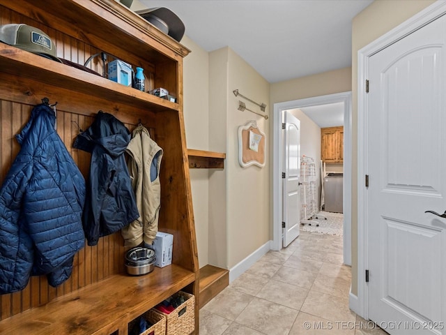 mudroom featuring baseboards and light tile patterned flooring