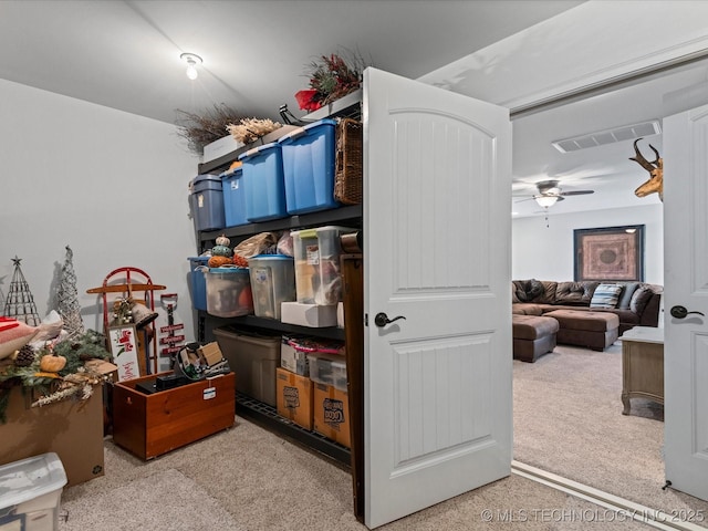 storage room featuring visible vents and ceiling fan