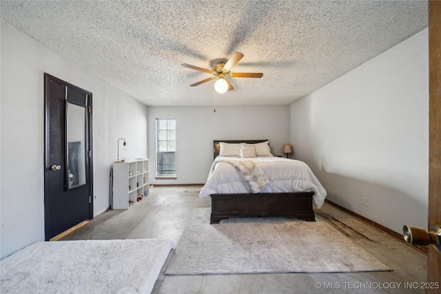 bedroom featuring baseboards, a textured ceiling, and ceiling fan