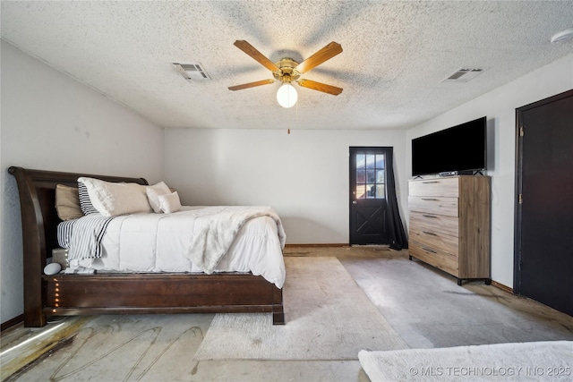 unfurnished bedroom featuring baseboards, visible vents, a textured ceiling, and a ceiling fan