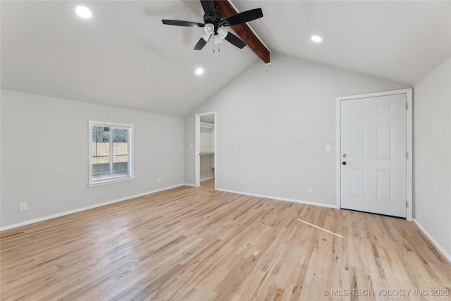 interior space with light wood-type flooring, a ceiling fan, recessed lighting, baseboards, and vaulted ceiling with beams