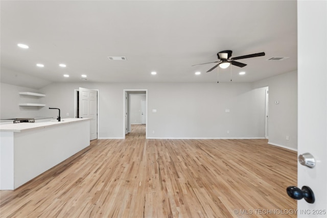 unfurnished living room with visible vents, recessed lighting, light wood-type flooring, and a ceiling fan