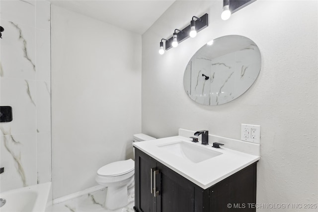 bathroom featuring marble finish floor, toilet, and vanity