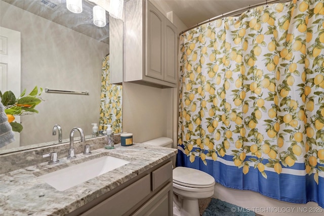 bathroom with vanity, toilet, a shower with curtain, and visible vents