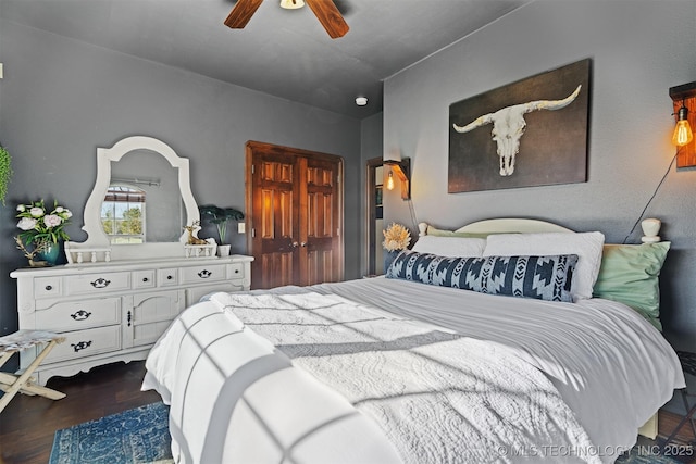 bedroom featuring a ceiling fan and wood finished floors