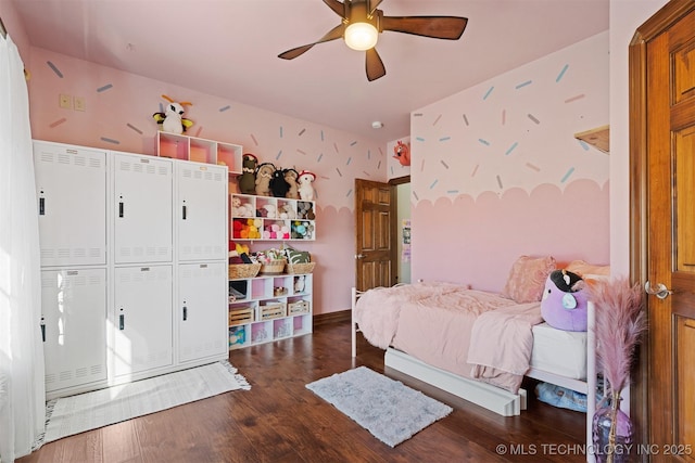 bedroom with ceiling fan and wood finished floors