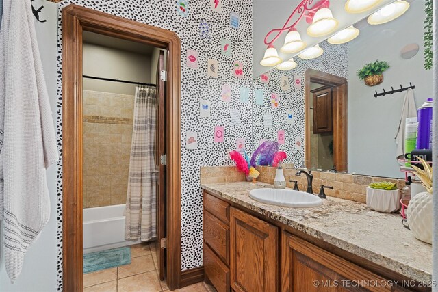 full bath with tile patterned floors, shower / tub combo, vanity, and wallpapered walls