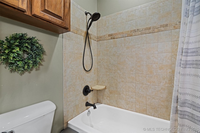 bathroom featuring toilet and shower / bath combo