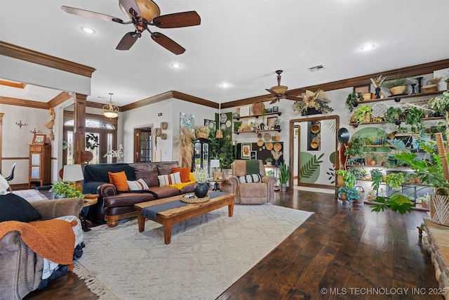 living room featuring hardwood / wood-style floors, visible vents, ornate columns, ornamental molding, and ceiling fan