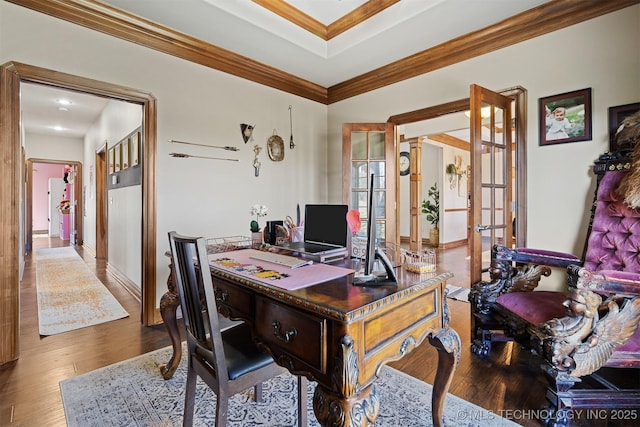 office area with crown molding, wood finished floors, and french doors