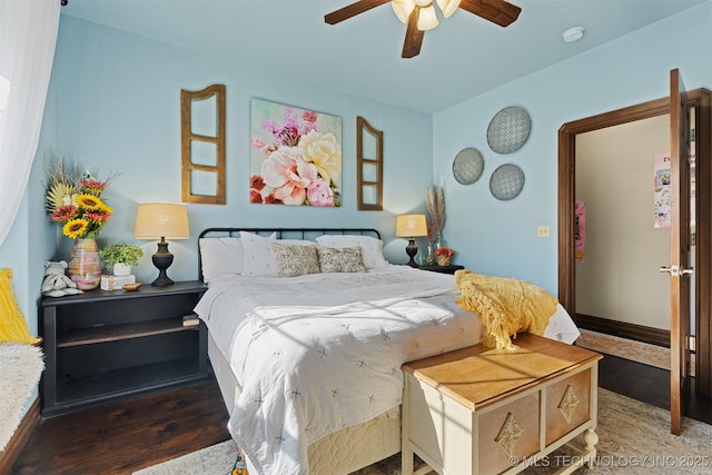 bedroom with wood finished floors, baseboards, and ceiling fan