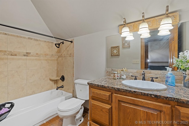 full bath with lofted ceiling, toilet, shower / washtub combination, and vanity