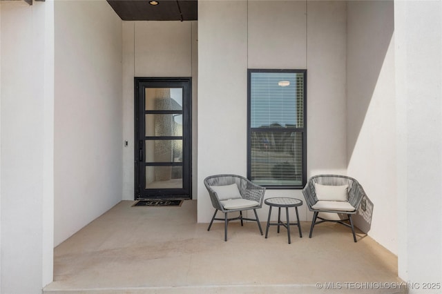 property entrance featuring stucco siding