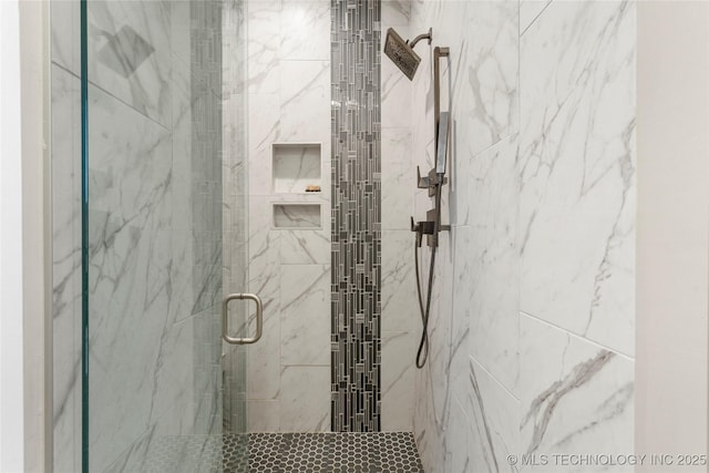 full bathroom with a marble finish shower