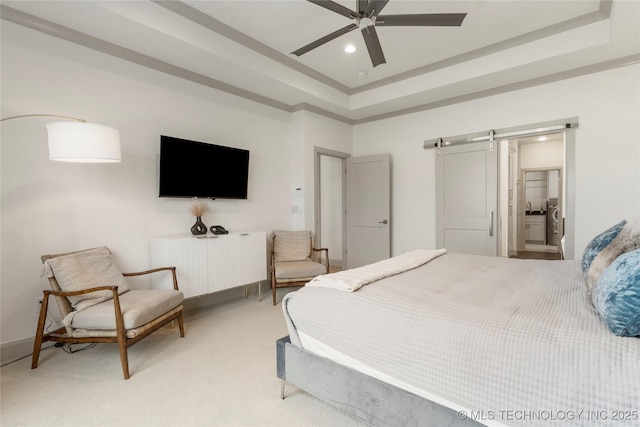 bedroom with a ceiling fan, recessed lighting, a barn door, a raised ceiling, and light colored carpet