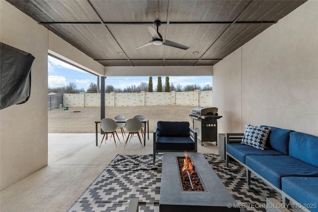 living room featuring a ceiling fan and concrete floors