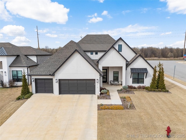 modern farmhouse with driveway, covered porch, a shingled roof, stucco siding, and a garage