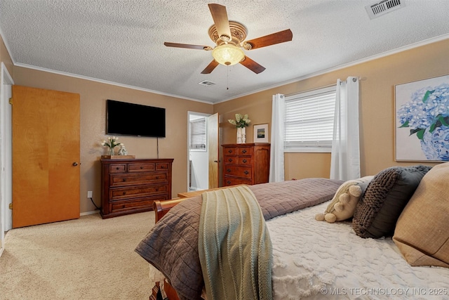 bedroom with visible vents, a textured ceiling, carpet flooring, and crown molding