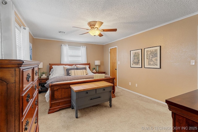 bedroom with visible vents, light carpet, ornamental molding, a textured ceiling, and ceiling fan